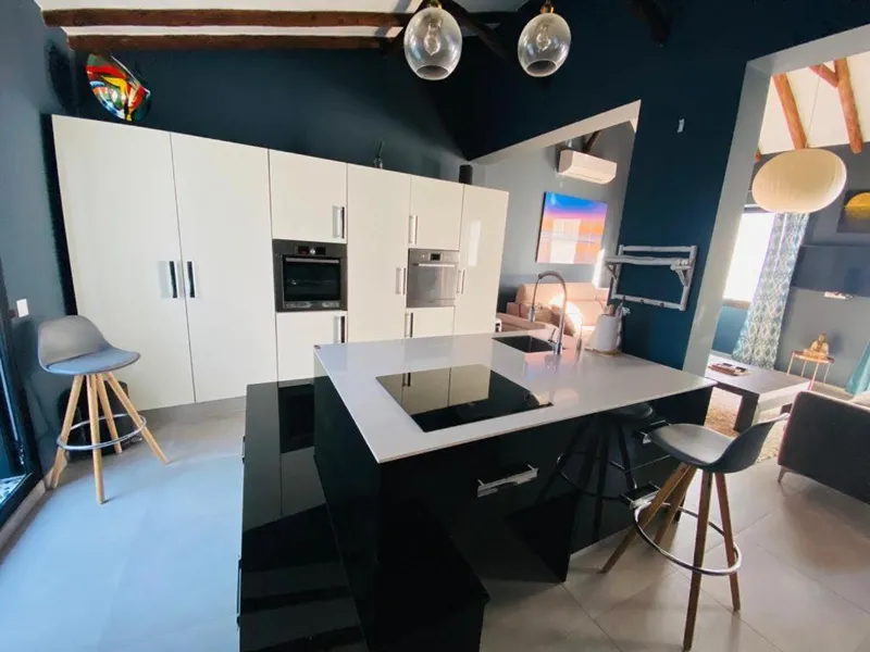 Kitchen with white cabinets and an induction island