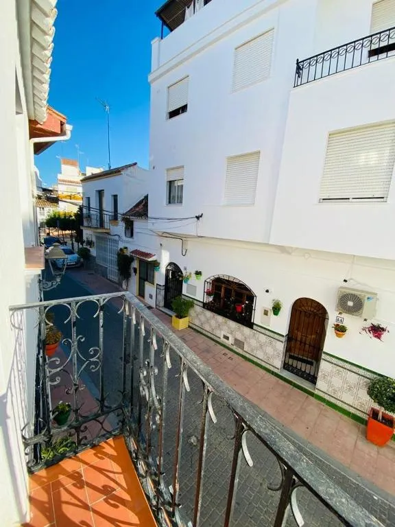 View in the other direction along the flower-lined Old Town street